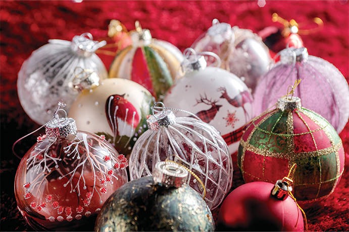 A selection of glass baubles on a red festive cloth