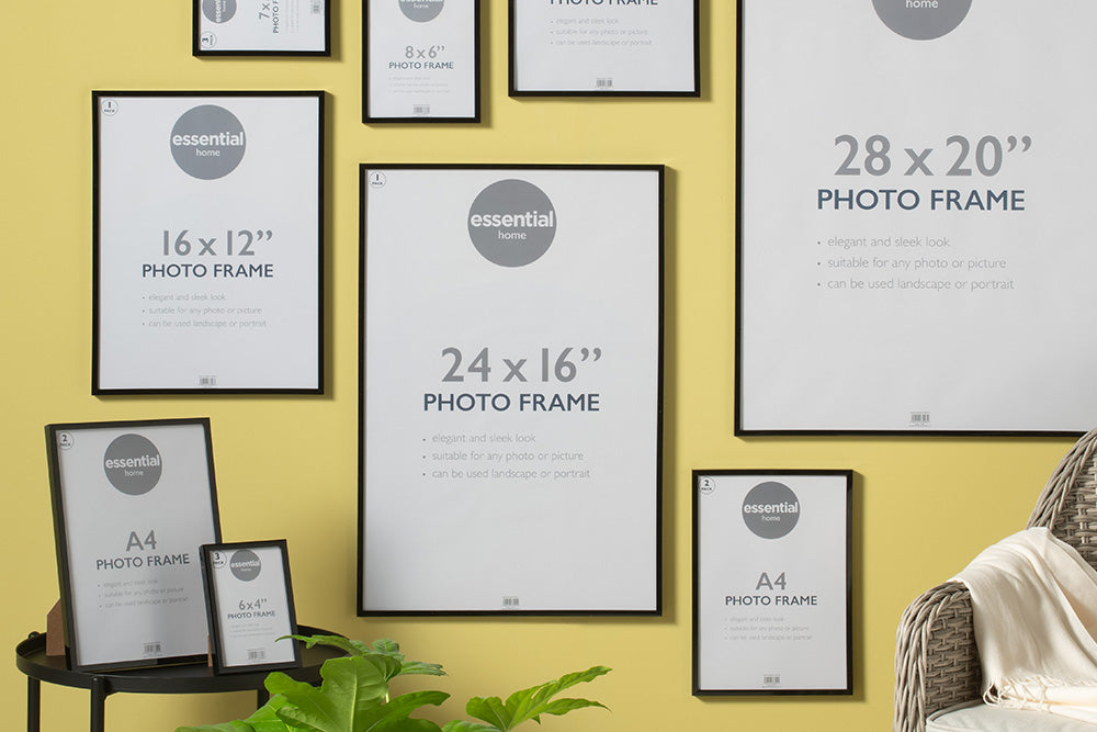 Assorted picture frames displayed on a the wall, offering a variety of styles and sizes